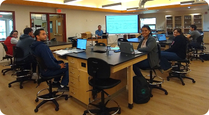Students and staff collaborating in a workforce training and educational classroom.
